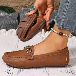 Flexible women's brown loafers with soft sole and metal buckle for casual wear.