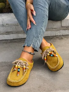 Yellow suede mule slippers with vibrant colorful beads and chunky platform sole