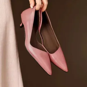 Elegant dusty pink pointed-toe kitten heels featuring a slim stiletto design for women.