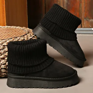 Women's black chunky platform snow boots featuring a warm knitted sock cuff design