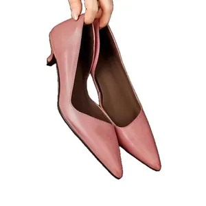 Elegant pink pointed toe kitten heel pumps for professional women's office work wear.