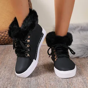 Stylish black women's winter snow boots featuring fluffy faux fur trim and platform soles