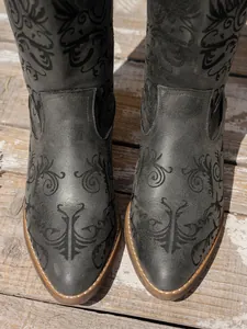 Detailed view of dark grey western boots with intricate embroidery and pointed toe