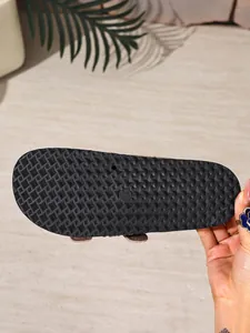 Close-up of the non-slip textured sole of a black platform Birkenstock style sandal
