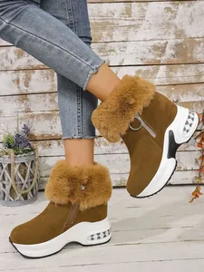Stylish brown women's platform snow boots featuring thick fur trim and side zipper for winter.