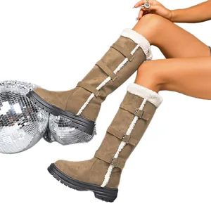 Tall khaki suede snow boots with white fur trim and buckle straps on a white background