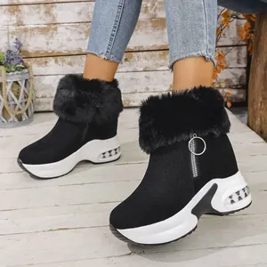 Close-up of black platform snow boots for women featuring a plush faux fur collar detail
