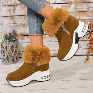 Stylish brown faux fur platform snow boots for women with comfortable thick wedge soles.