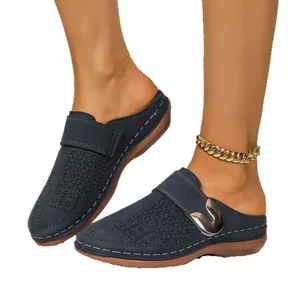 Navy blue breathable flat closed-toe mules with Velcro strap and metal buckle