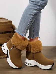 Side view of women's brown snow boots with warm faux fur trim and platform sole