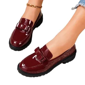Elegant burgundy patent leather loafers with vintage fringe and gold metal T-buckle