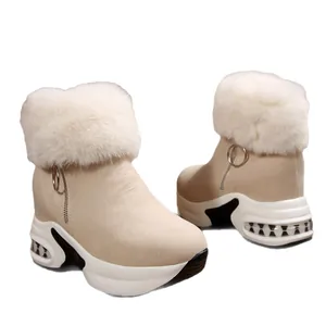 Stylish beige platform snow boots with fluffy faux fur trim and side zipper closure.