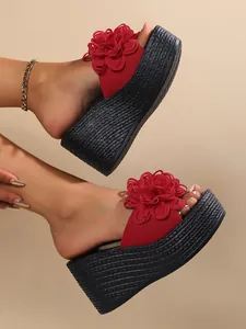 Side view of elegant red flower wedge sandals featuring thick black braided platform