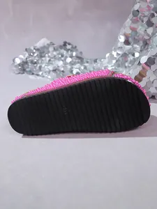 Bottom view of pink pearl platform sandal showing black non-slip ribbed sole texture