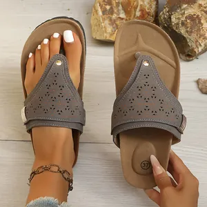 Women's retro casual flat flip-flops with laser-cut patterns and buckled detail