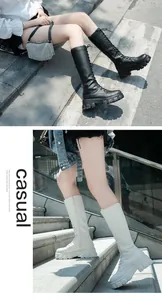 Detail view of women's lace-up tall boots with thick lug soles and side zippers