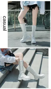 White platform knee-high boots featuring side zipper and lace-up front detail for women