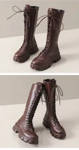Close-up detail of brown lace-up tall boots with thick platform sole and side zipper.