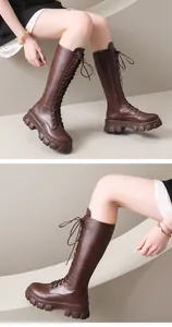 Detailed view of stylish brown lace-up platform tall boots featuring a side zipper.