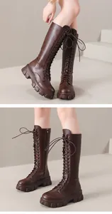 Detailed view of stylish brown lace-up platform knee-high boots with side zipper for women