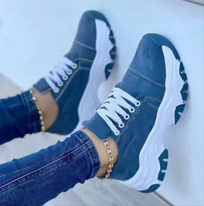 Close-up view of blue suede chunky platform sneakers for women with white sole