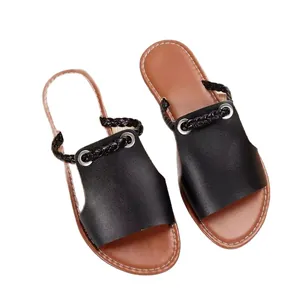 Stylish women's black flat beach sandals featuring braided straps and tan stitched soles