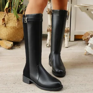 Classic British style black knee-high boots with side zipper and metal buckle detail