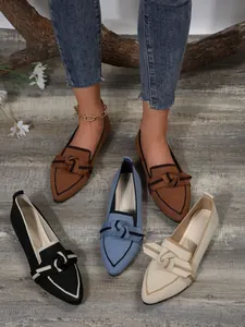 Close-up detail of pointed toe flyknit loafers for women featuring stylish bow knots in various colors