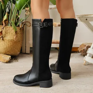 Black British style knee-high riding boots with side zipper and decorative buckle detail.