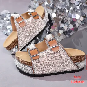 Detailed side view of elegant pearl and rhinestone platform slides showing 5cm heel height