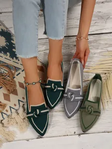 Pointed-toe fly-knit loafers with bow detail shown in dark green and grey shades.