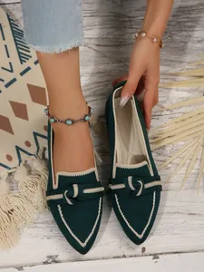 Stylish dark green pointed toe flat loafers with fly-knit texture and knot detail