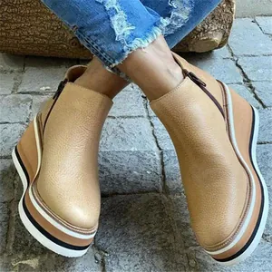 Casual women's beige leather wedge ankle boots with side zipper and striped platform sole