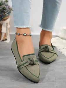 Comfortable women's pointed-toe knit loafers in sage green with stylish knot detail