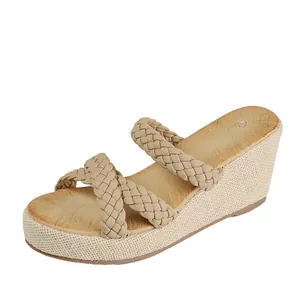 Elegant beige women's wedge sandals featuring braided straps and a stylish woven platform sole