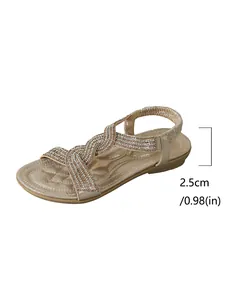 Close-up detail of 2.5cm low heel height on elegant gold rhinestone women's beach sandals