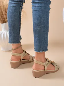Elegant bohemian gold wedge sandals for women with comfortable elastic straps shown on feet