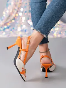 Detailed view of orange slingback high heels with embroidered woven toe and buckle