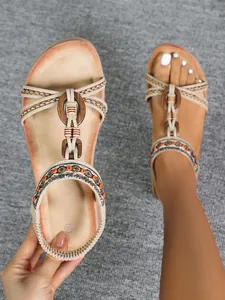 Bohemian retro flat sandals featuring a stylish wooden buckle and braided straps