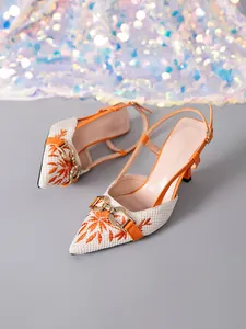 Elegant orange floral embroidered slingback pumps featuring gold buckle and thin kitten heels