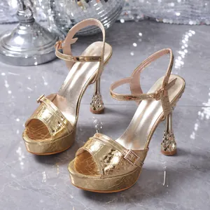 Elegant golden platform high heel sandals with ankle strap and decorative wine glass heel
