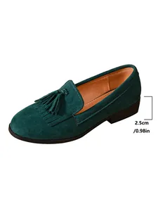Women's retro green suede tassel loafer detail showing 2.5cm low heel height dimension