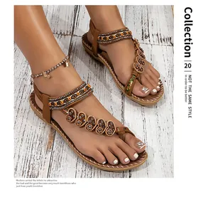 Detailed view of bohemian flat sandals with ethnic beading and heart patterns