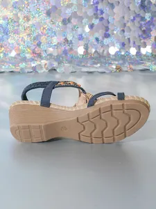Detailed view of a bohemian wedge sandal featuring beaded straps and a size 37 sole