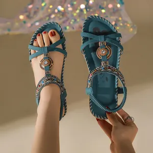 Teal blue Bohemian flat sandals featuring intricate handmade beadwork and rhinestone accents