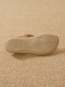 Close-up of non-slip rubber sole with floral patterns on Bohemian flat sandals