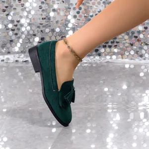 Retro dark green suede loafers with tassel detail and round toe for women.