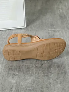 Detailed view of the anti-slip sole and elastic strap of Bohemian flat sandals