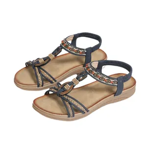 Women's flat Bohemian sandals with ethnic braided straps and open-toe beach design