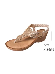 Detail view of Bohemian wedge sandals featuring rhinestone beads and 5cm heel height.